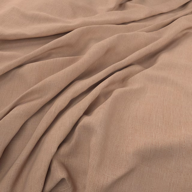 Warm blush-taupe fabric with a fine open weave gathered into fluid folds