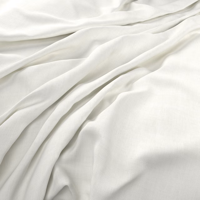 Soft chalk-white fabric with a fine weave falling in fluid, layered folds