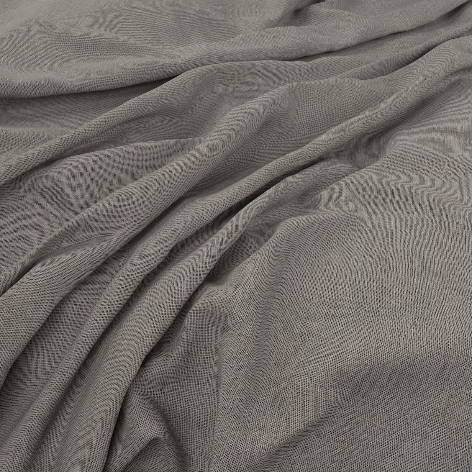 Soft fog-grey plain weave fabric gathered into fluid, shadowed folds
