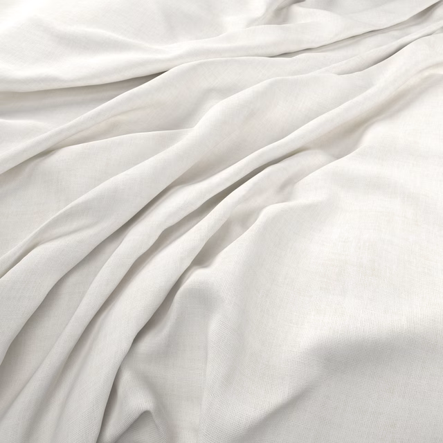 Soft ivory plain-weave fabric loosely folded, showing fine texture and gentle tonal shadows