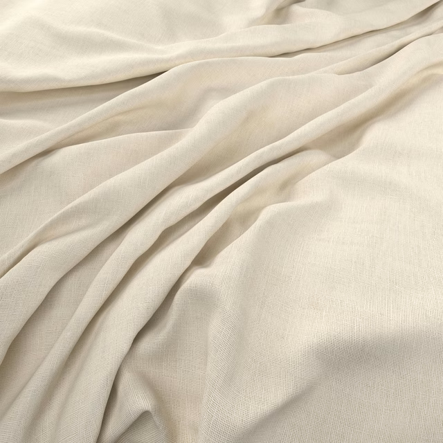 Warm ivory plain-weave cloth gathered into soft, fluid folds