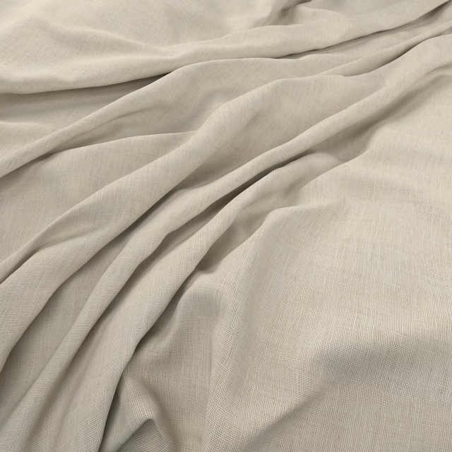 Pale greige Flanders fabric with a fine crosshatch weave in soft folds