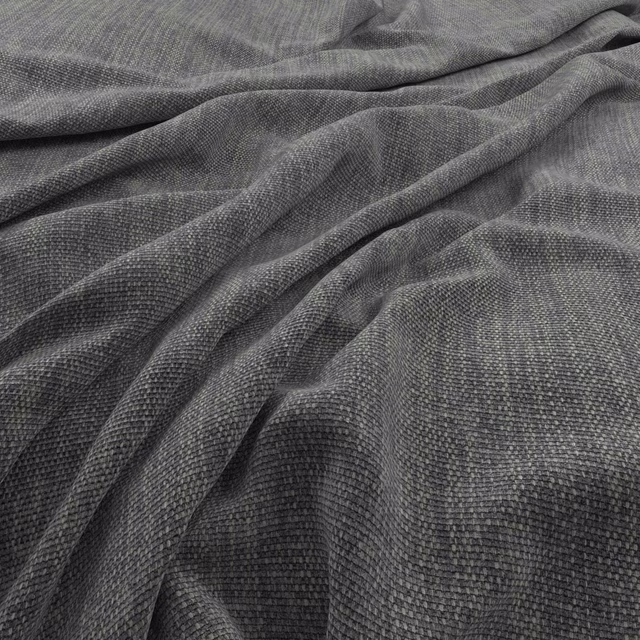 Charcoal granite-grey textile with fine pebbled weave gathered into soft folds