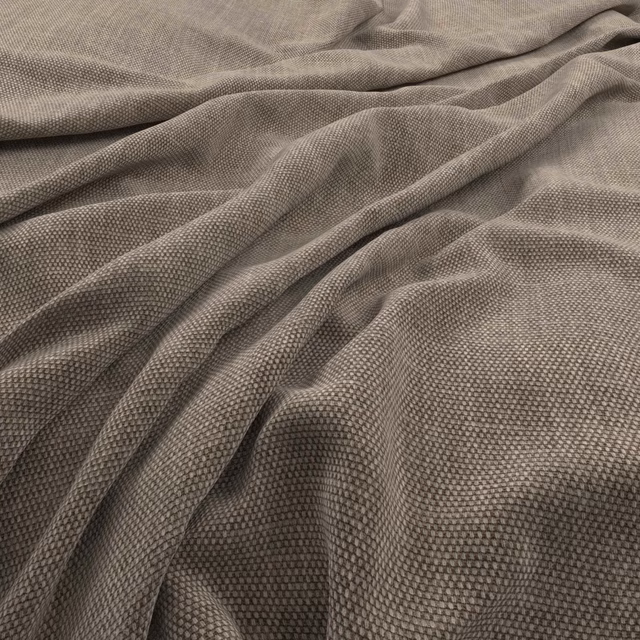 Warm praline taupe fabric with dense pebbled weave arranged in soft folds