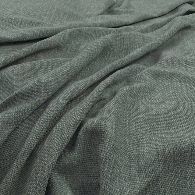 Muted sea-green woven fabric with pebbled texture gathered into soft folds