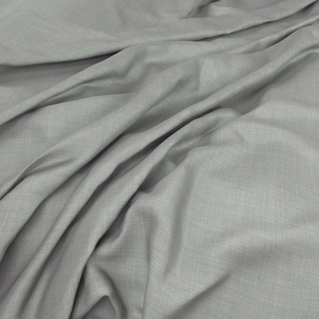 Pale cloud-grey fabric with a fine crossweave falling in soft gathered folds