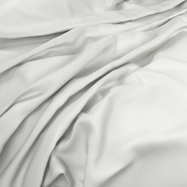 Pale cool grey fabric falling in soft, smooth diagonal folds