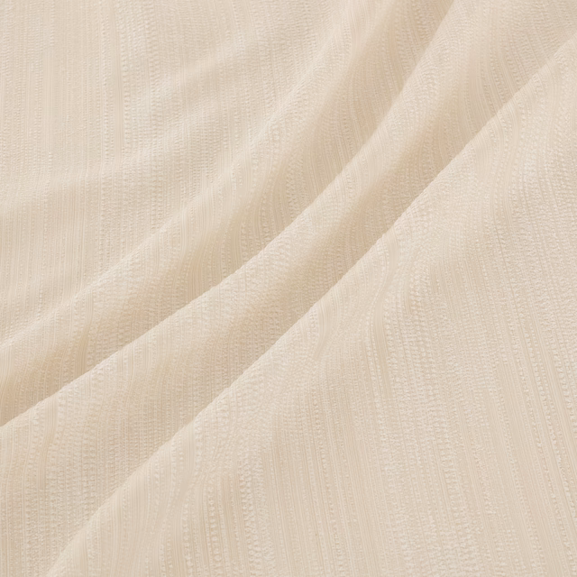 Warm ivory fabric with fine vertical woven texture in soft diagonal folds