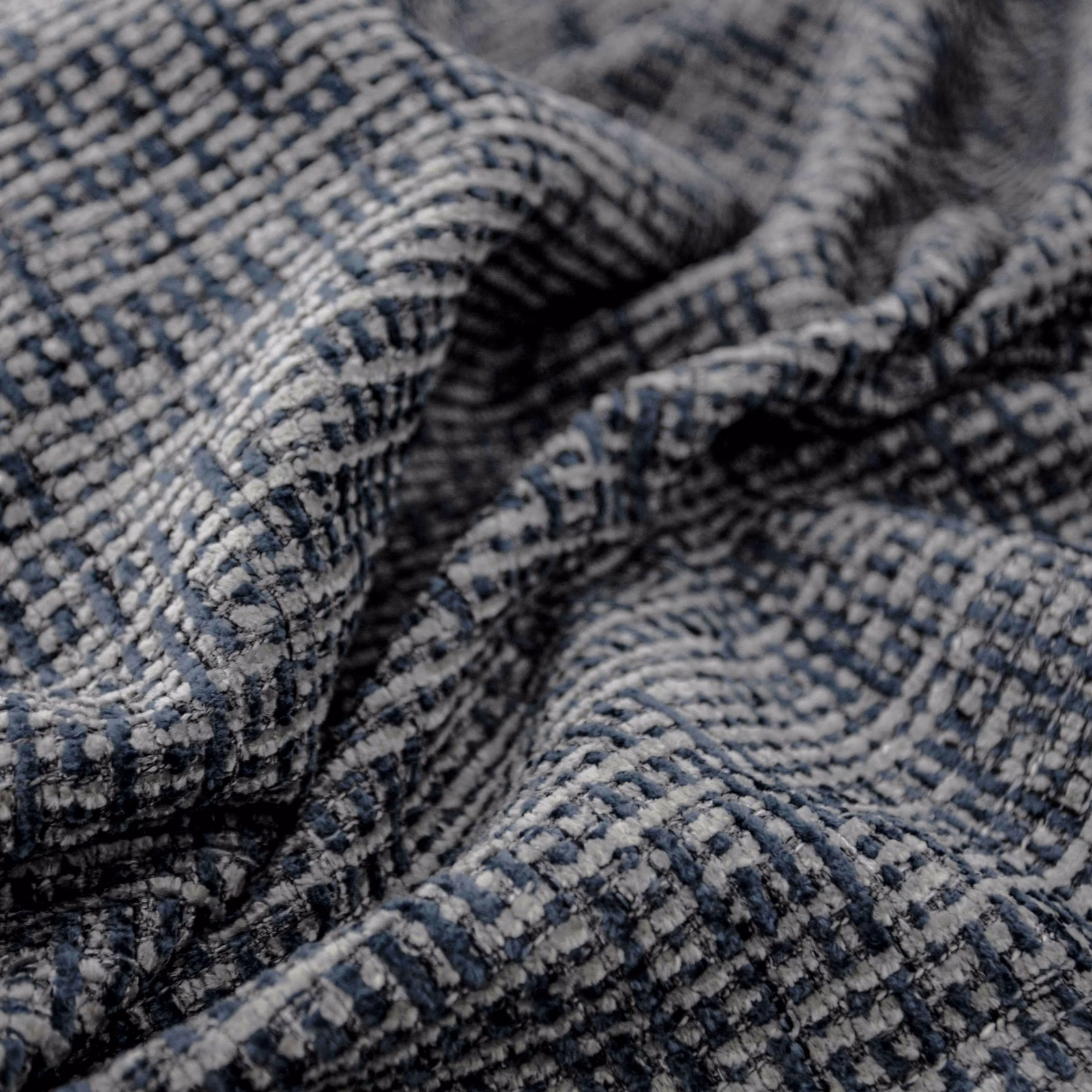Nubby denim-blue upholstery weave with charcoal flecks and pale grey broken checks