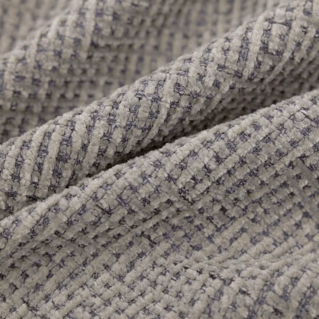 Stone-grey Gabba textile with charcoal broken grid and raised nubby weave