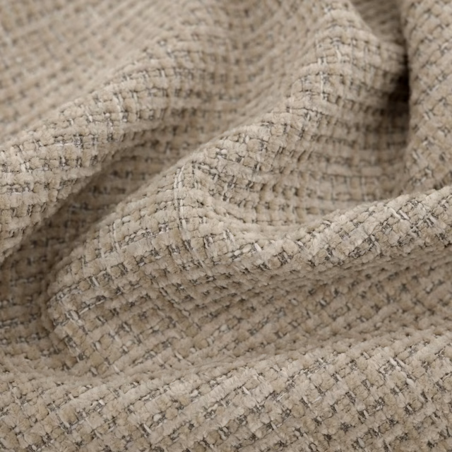 Warm oatmeal woven textile with charcoal flecks and raised nubby texture