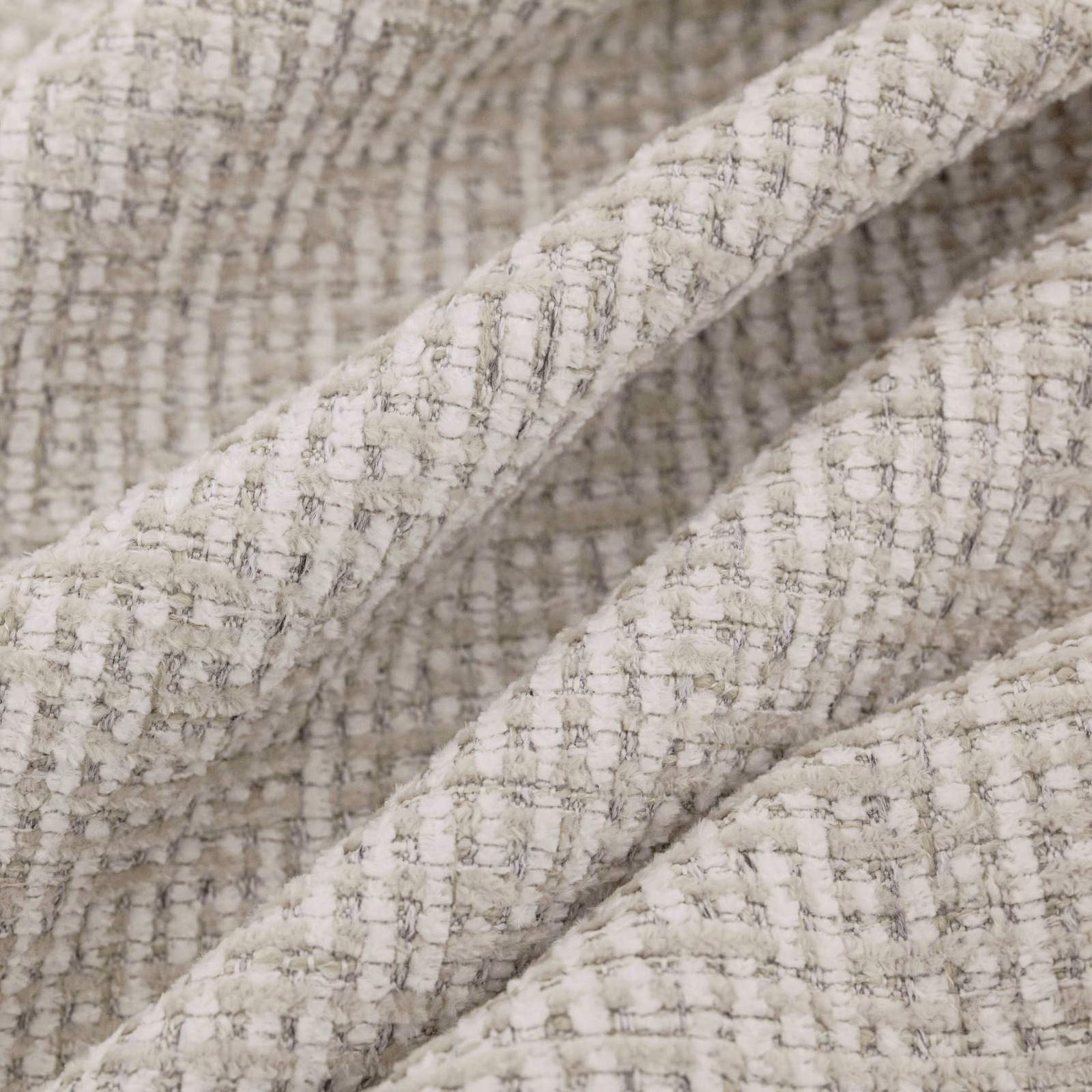 Close-up of warm oyster cream woven fabric with raised grey checked texture
