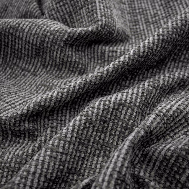 Deep plum-charcoal woven fabric with a small ridged grid texture