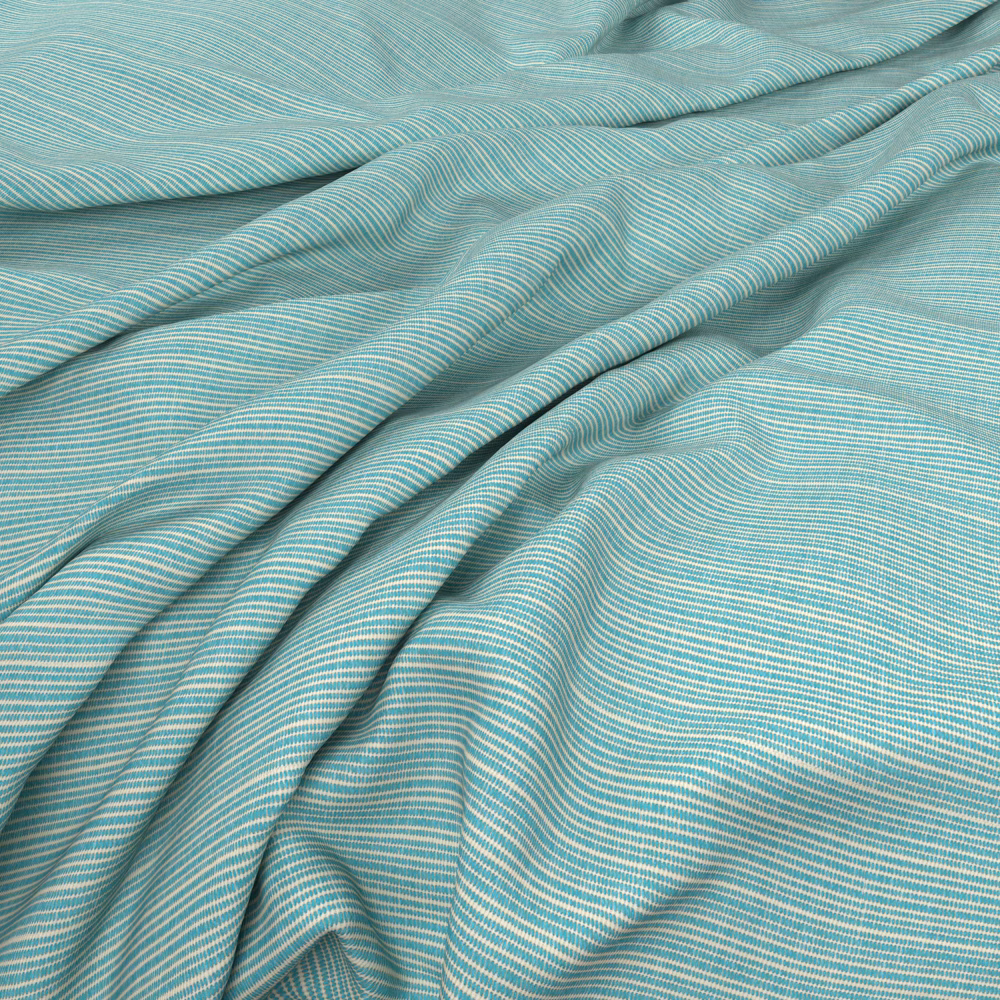 Cool aqua-blue fabric with fine pale ripples gathered into soft folds