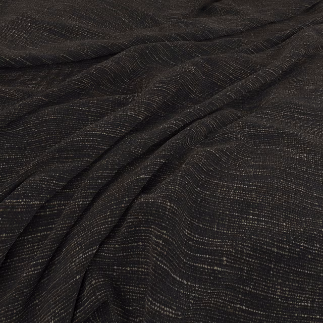 Ebony-black woven fabric with fine wavering lines across softly folded cloth