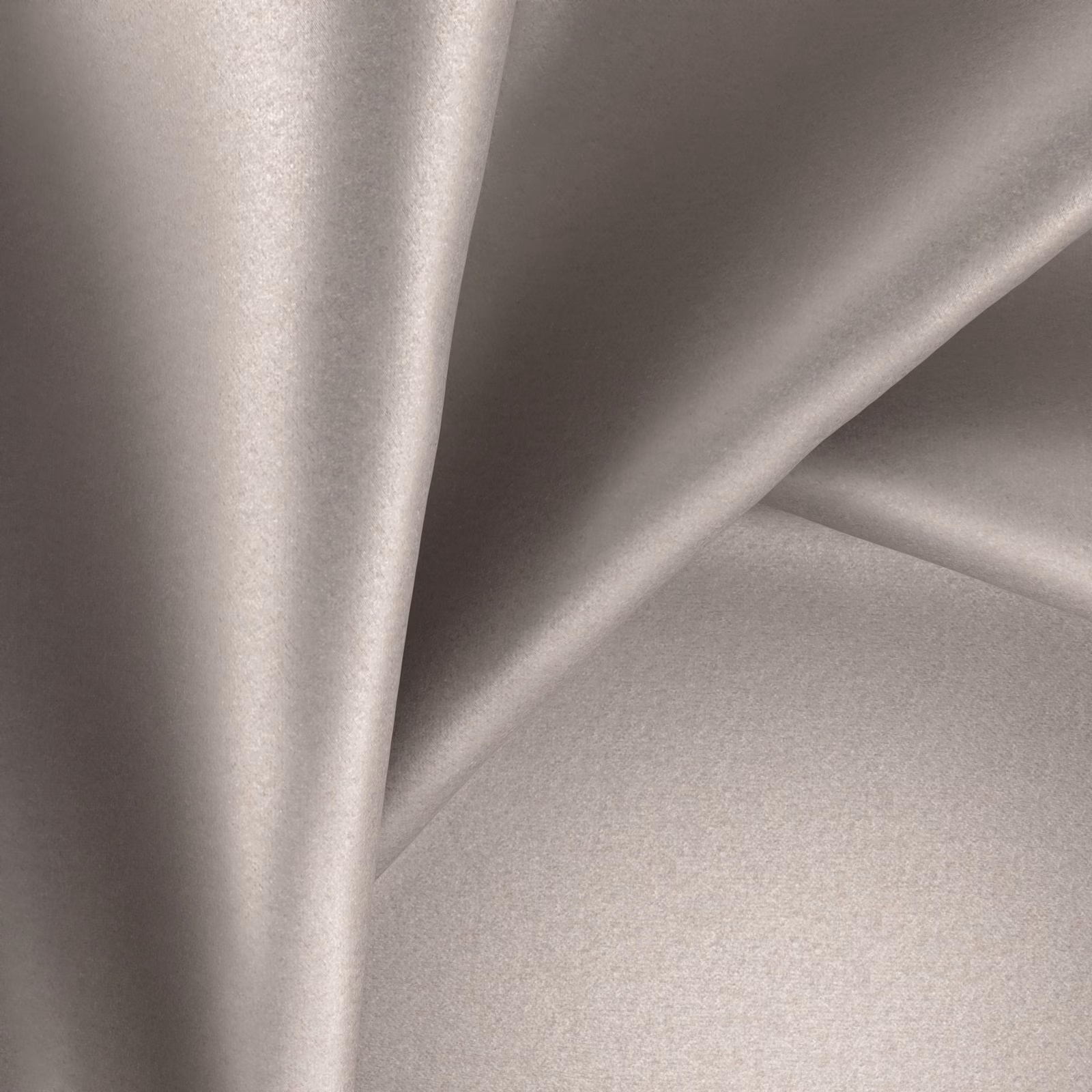 Pale warm greige plain fabric draped in smooth folds with a soft satin sheen