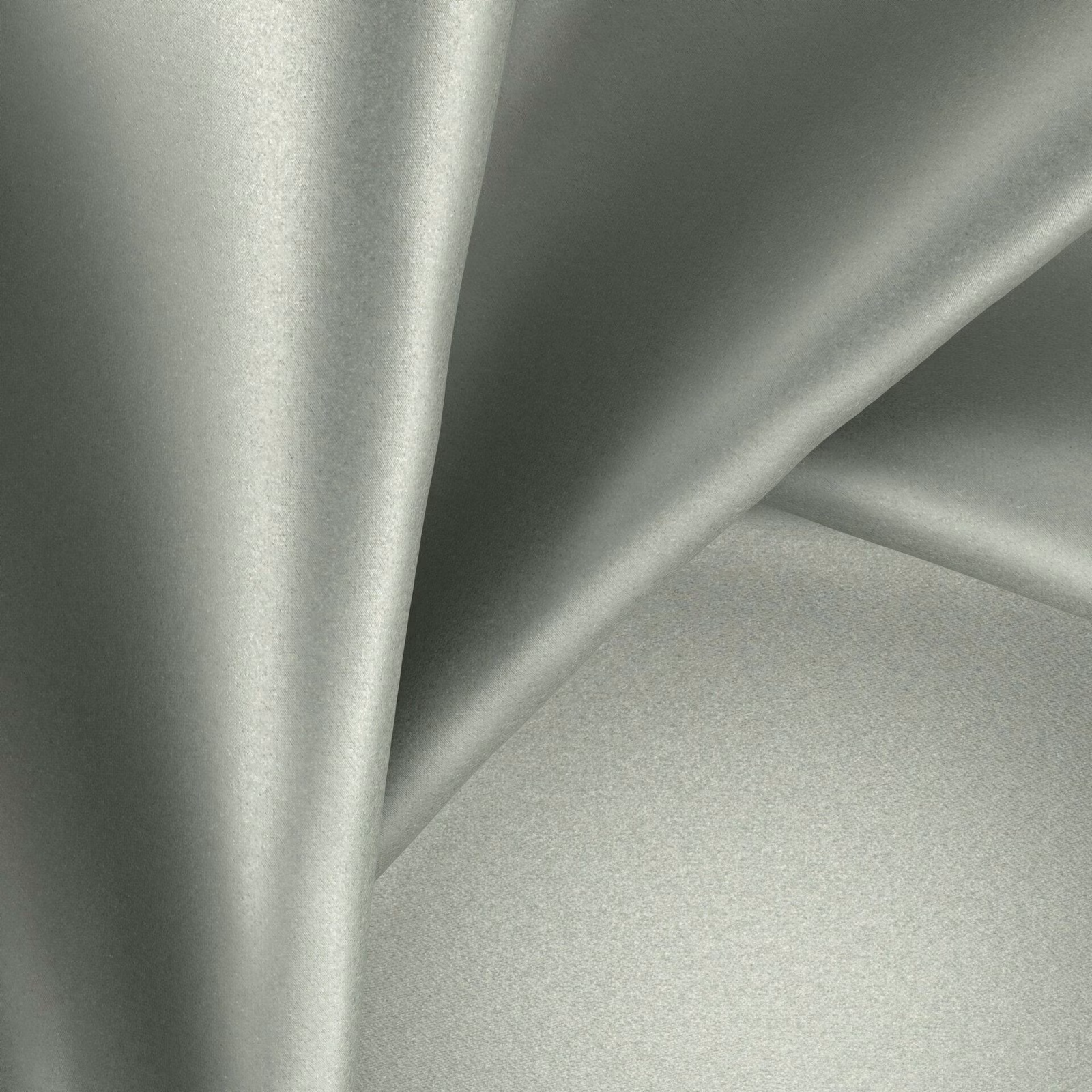 Pale mineral-grey fabric with a softly reflective surface arranged in fluid folds