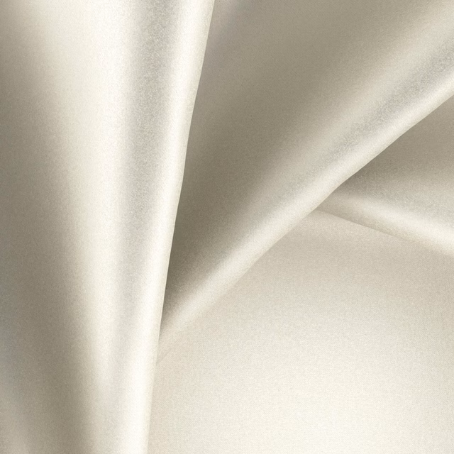 Pale moonstone-grey fabric with smooth satin-like sheen falling in soft folds