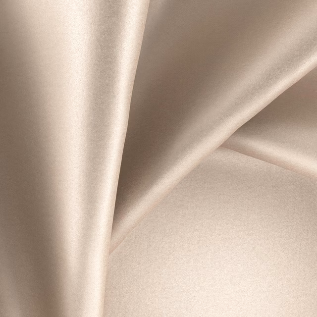 Warm sepia taupe fabric with a softly reflective, smooth surface in folded drape