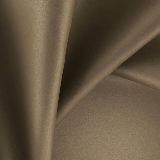 Warm sorrel-brown glossy fabric folded to show its soft reflective surface