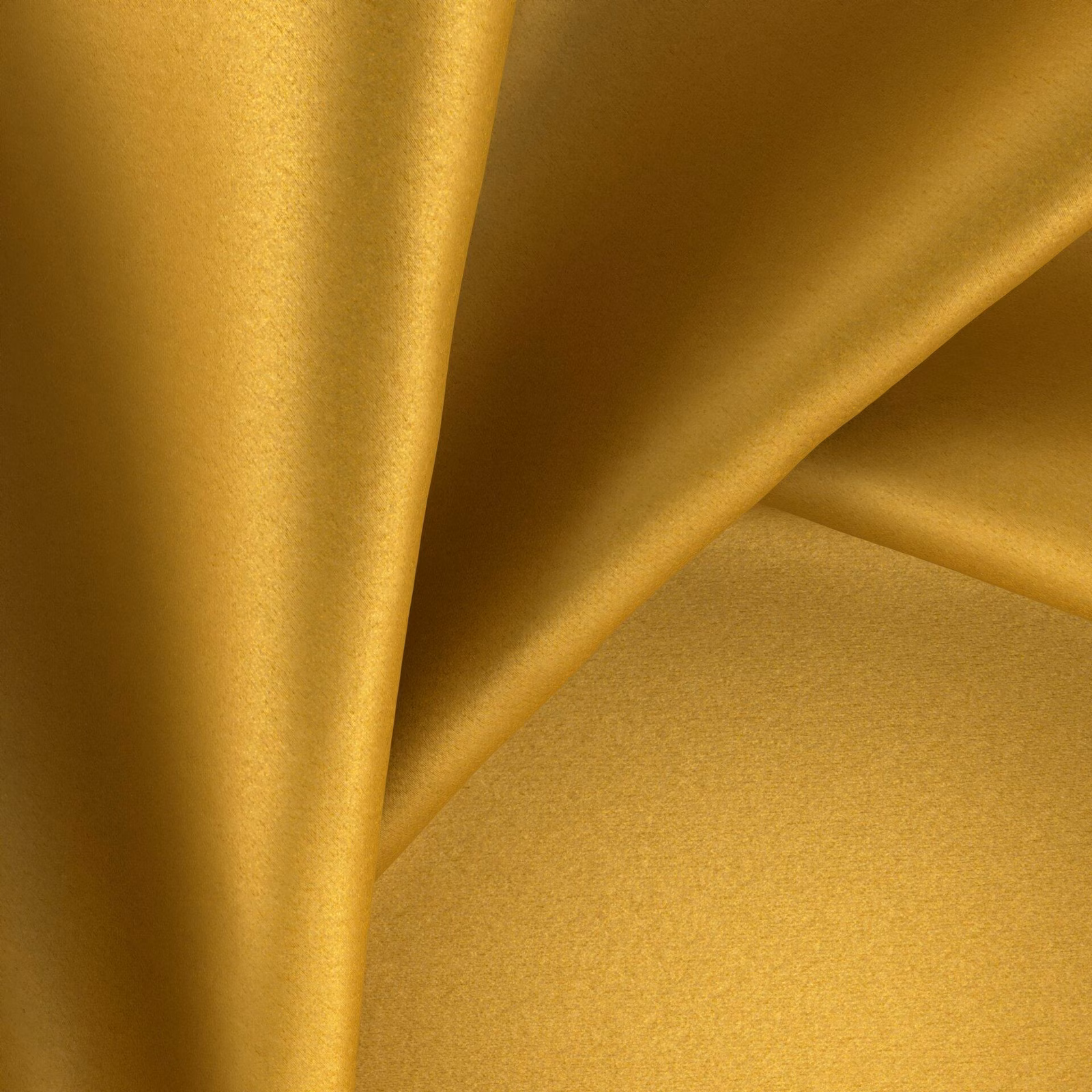Warm golden topaz fabric with a smooth sheen folding into soft drapes