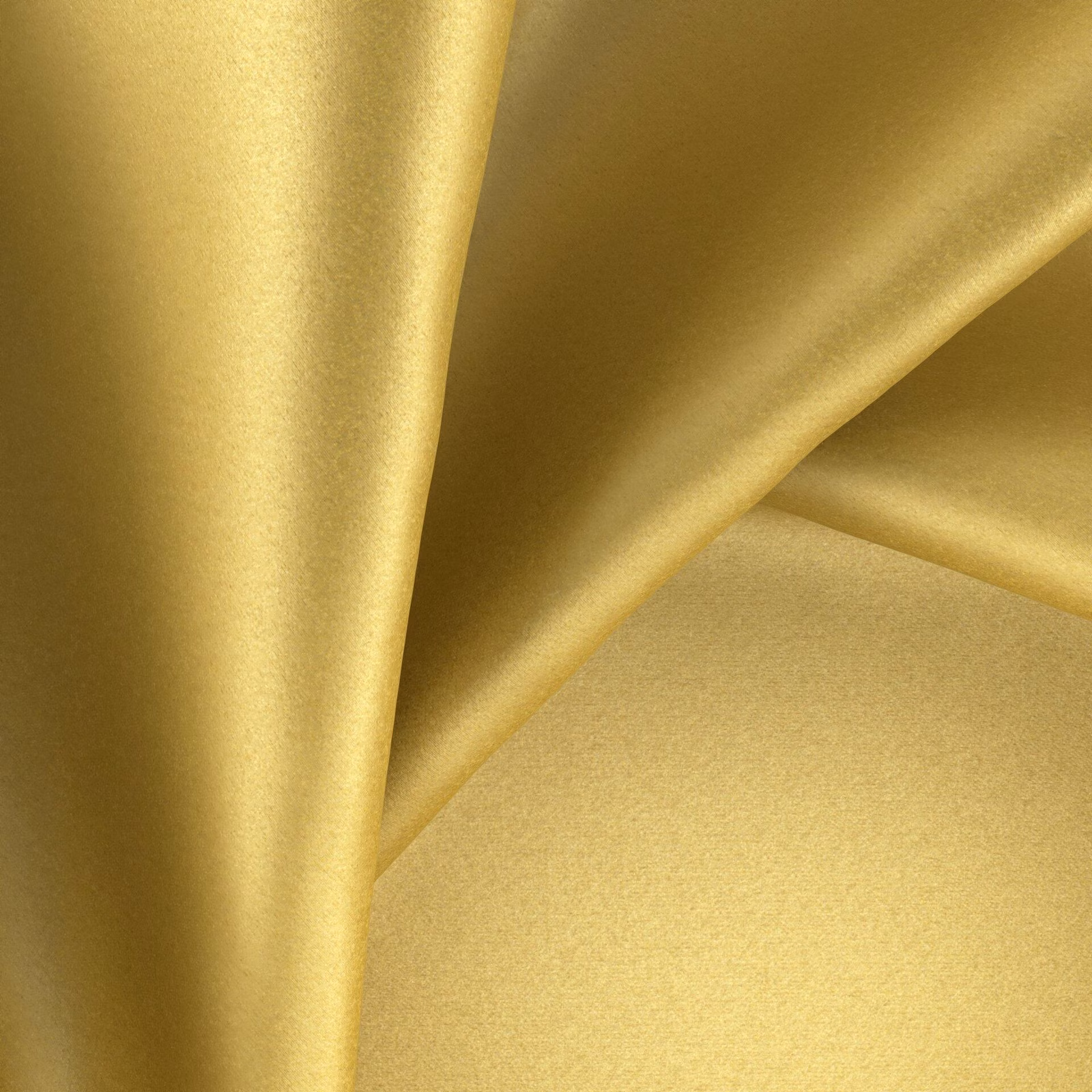 Close view of golden-yellow plain fabric with a smooth lustrous sheen in folds