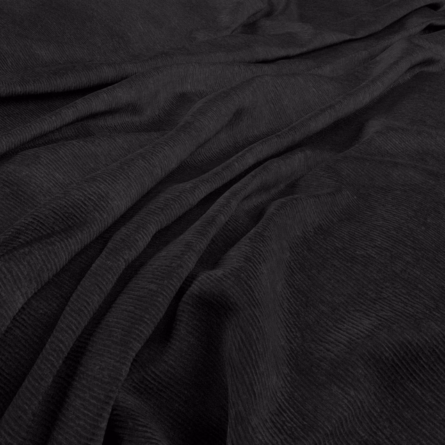 Near-black ribbed fabric with soft folds and subtle charcoal tonal variation