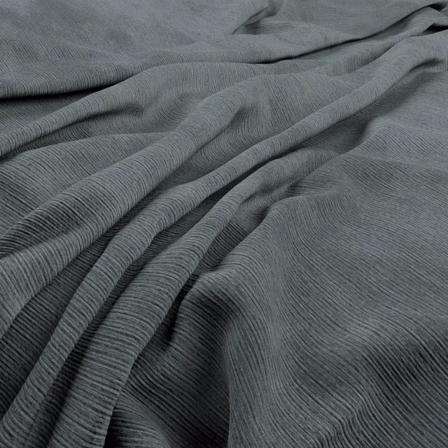 Blue-grey Graf fabric with fine linear ridges falling into deep fluid folds