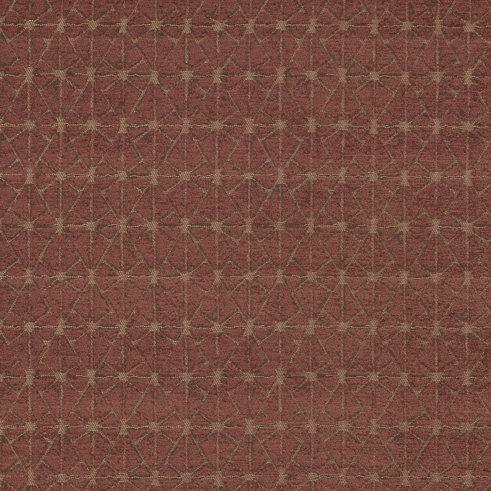 Terracotta geometric upholstery fabric with fine light lattice on a warm rust ground