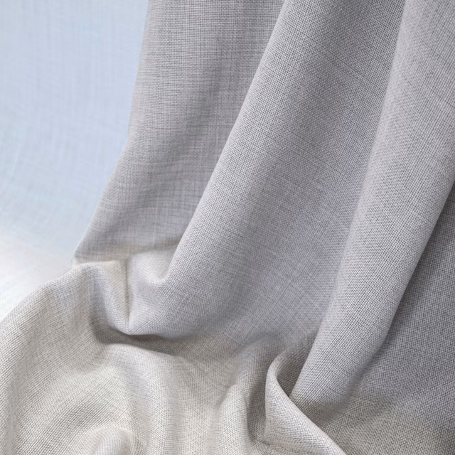 Pale grey-beige woven cloth falling in soft, fluid folds