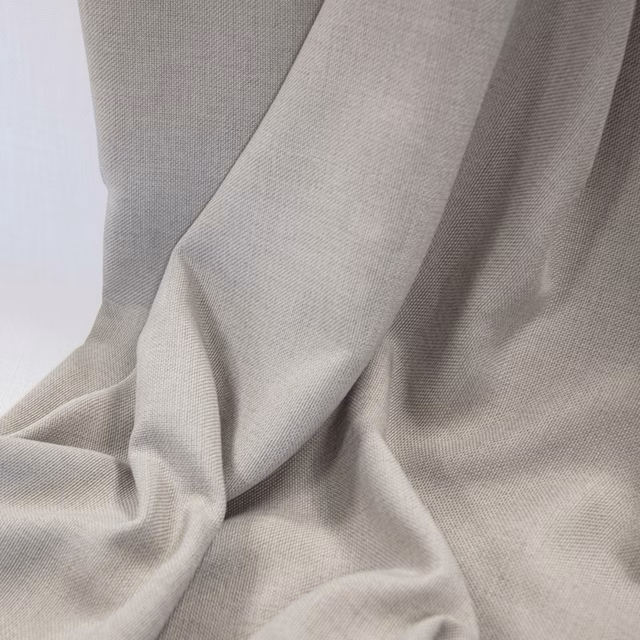 Softly draped shell-beige fabric showing a fine, delicate woven texture