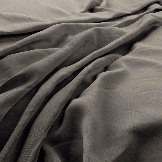 Andesite heavy linen in charcoal taupe, shown in soft folds with a fine plain weave.