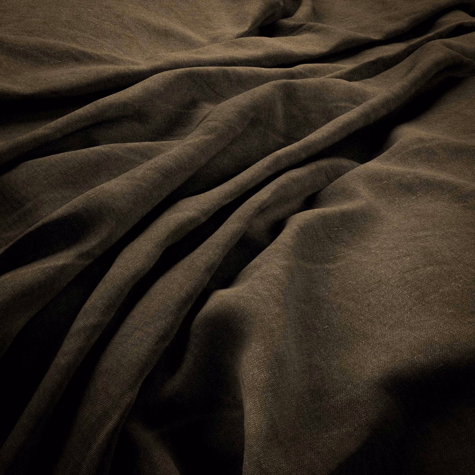 Deep khaki-olive plain weave gathered into heavy, shadowed folds