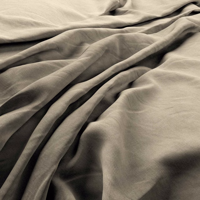 Warm pumice taupe linen fabric shown in soft folds with fine woven texture