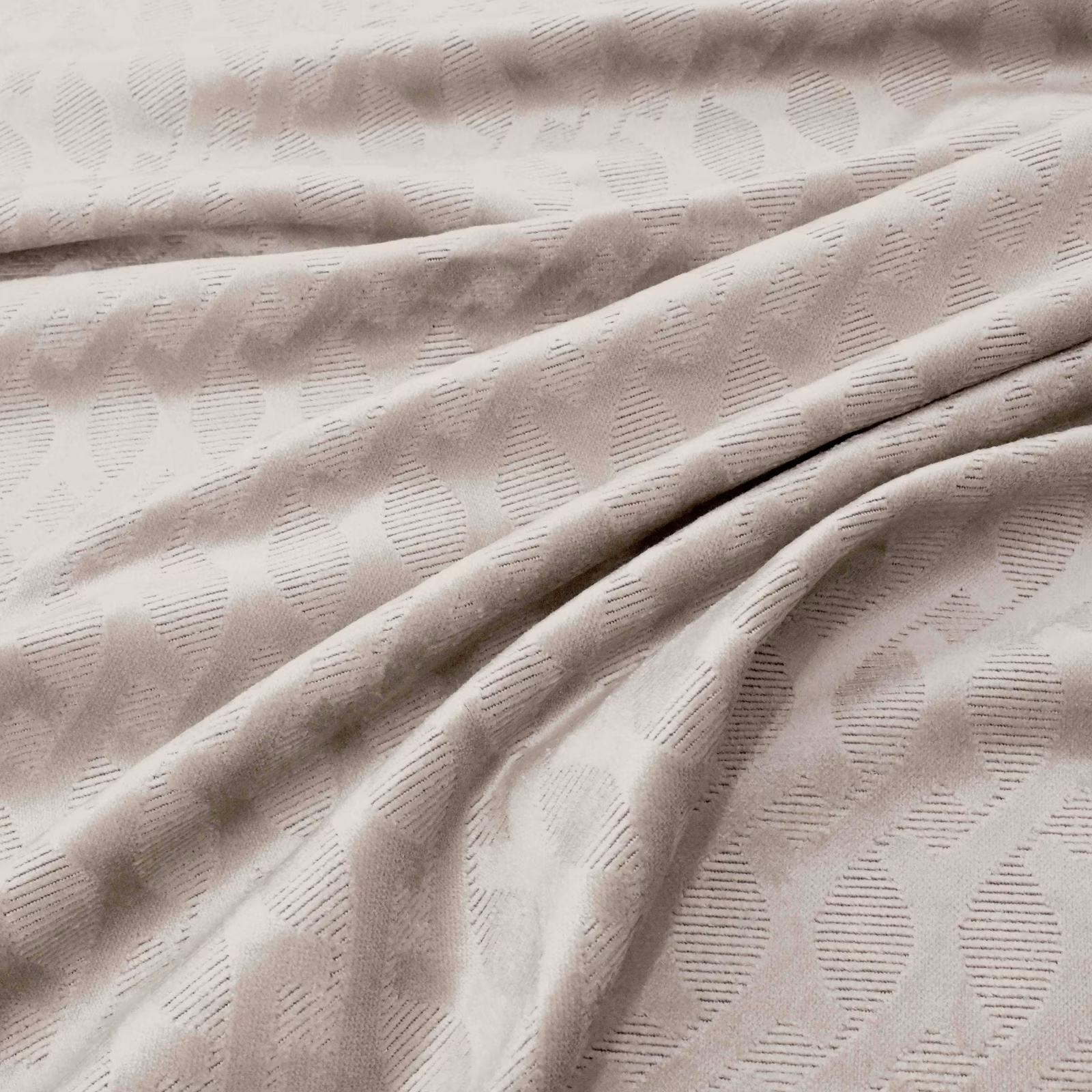 Pale oyster fabric with raised oval motifs and fine horizontal hatching in soft folds