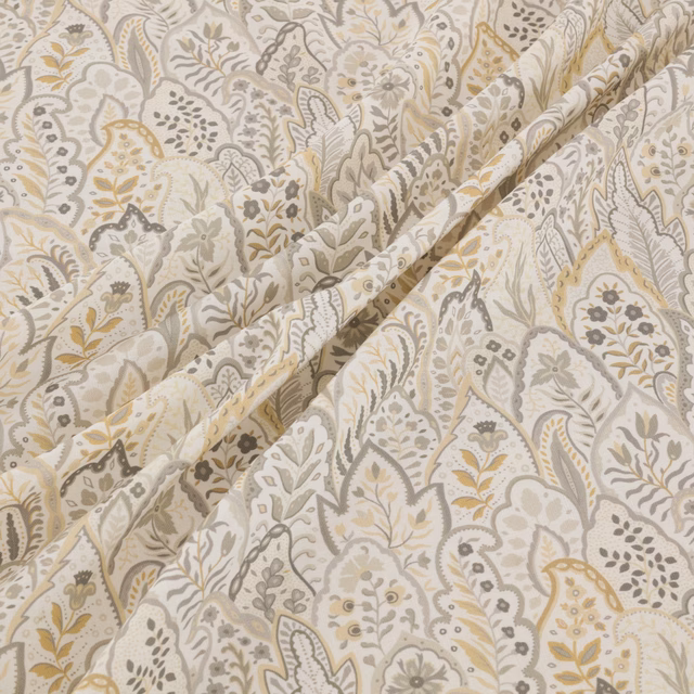 Cream Hitherhill textile with grey, taupe and ochre paisley botanicals in soft folds