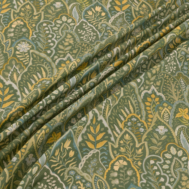 Muted kelp-green paisley fabric with ivory florals and ochre botanical detail