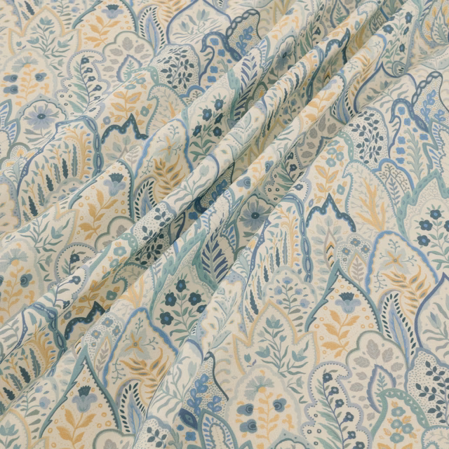 Pale blue and sage paisleys with ochre florals on an ivory ground