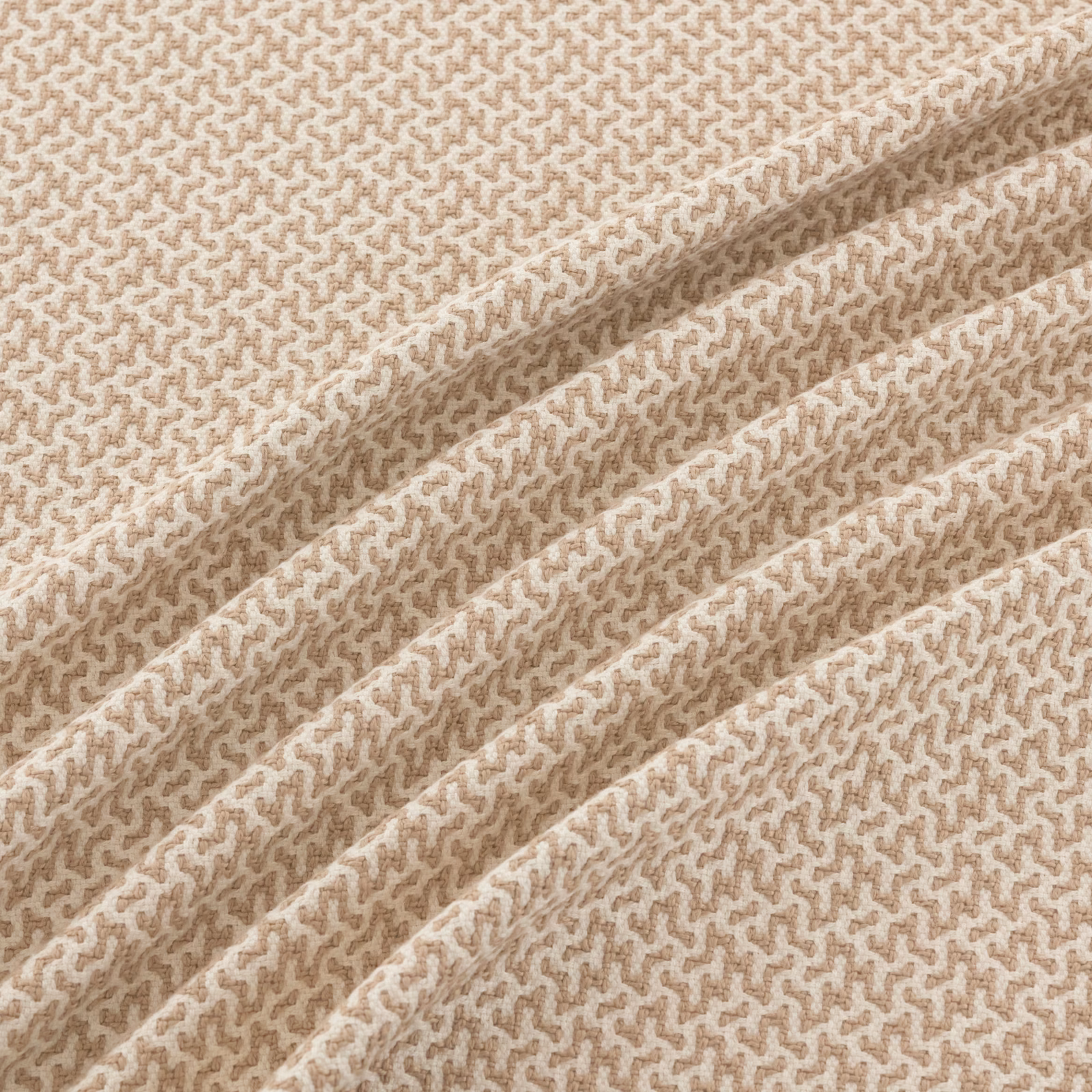 Warm beige and cream woven swatch with small meandering texture across soft folds