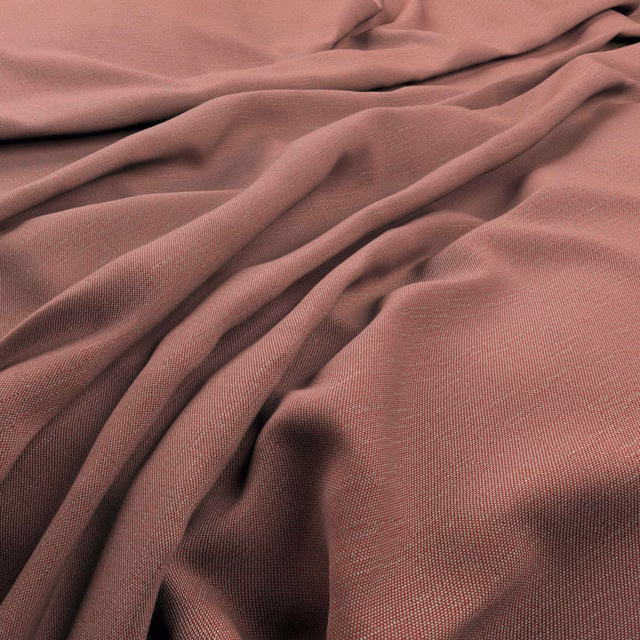 Close-up of muted coral-rose fabric with a fine plain weave and fluid folds