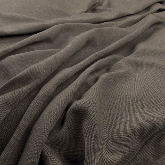 Deep gunmetal grey fine weave fabric falling into soft, fluid folds