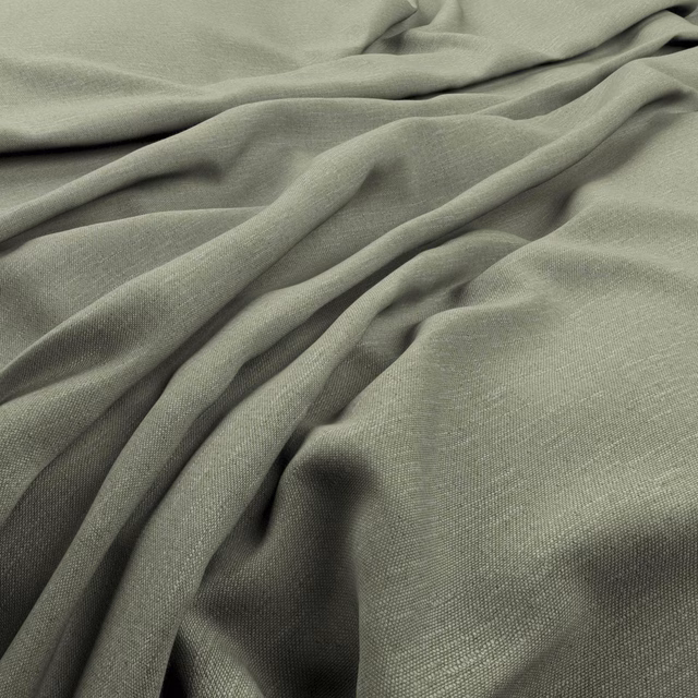 Muted kiwi-green finely woven fabric gathered into soft, fluid folds