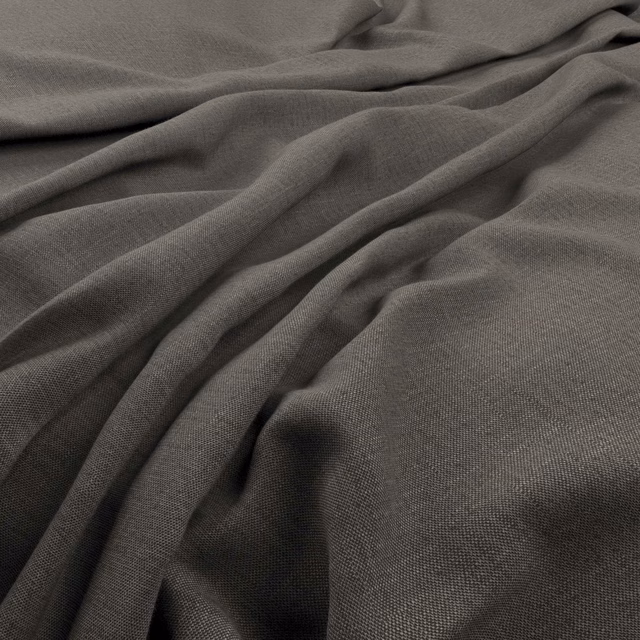 Charcoal taupe finely woven fabric gathered into soft, shadowed folds