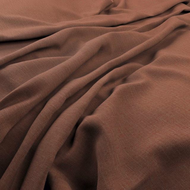 Warm russet-brown finely woven fabric falling in soft, fluid folds