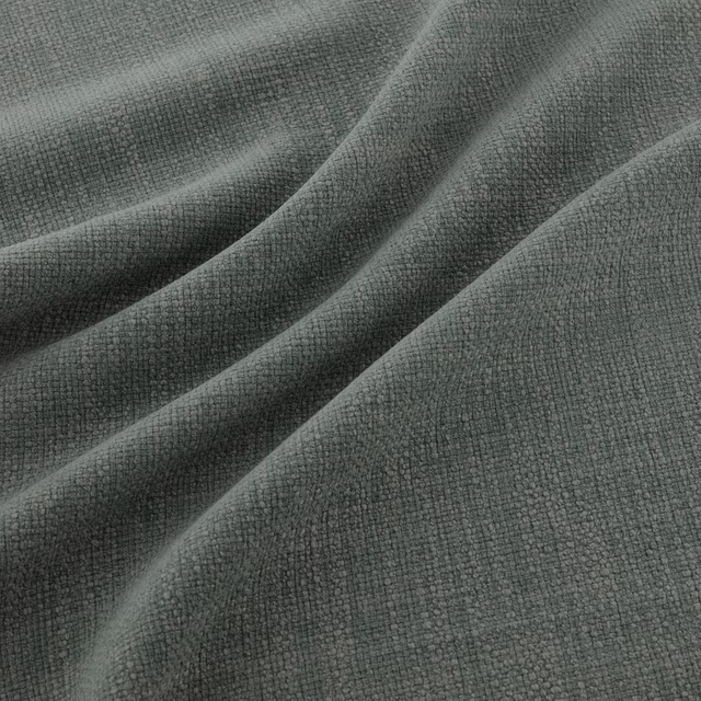 Muted slate-blue Jaeger fabric with fine crosshatch texture falling into soft folds