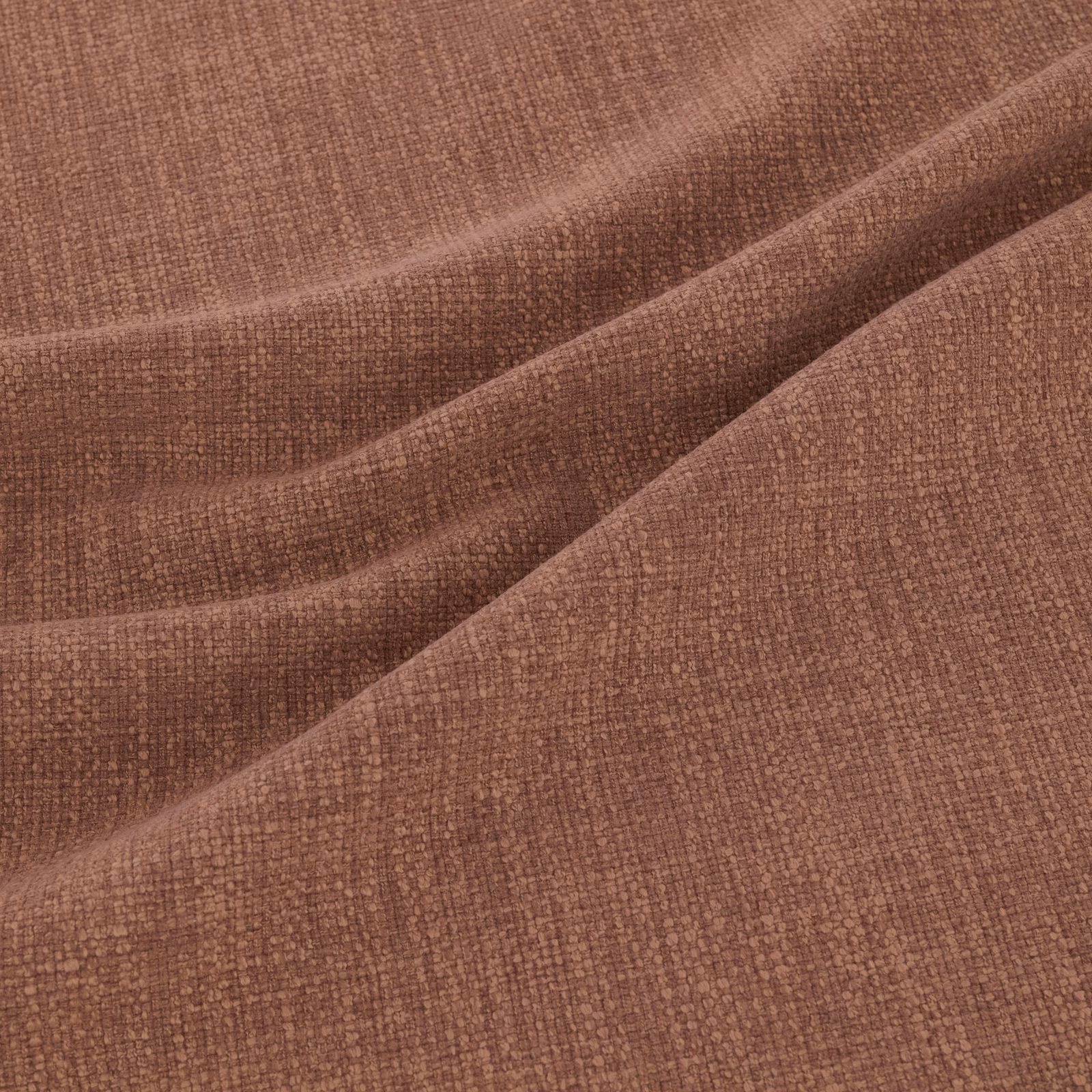 Close-up of dusty beetroot-red fabric with a fine, tactile woven texture
