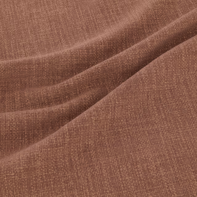 Close-up of dusty beetroot-red fabric with a fine, tactile woven texture