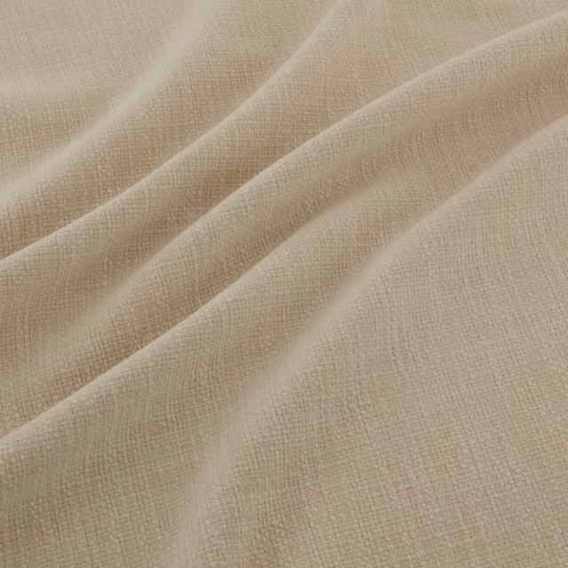 Warm buff beige fabric with fine crosshatch weave gathered into soft folds