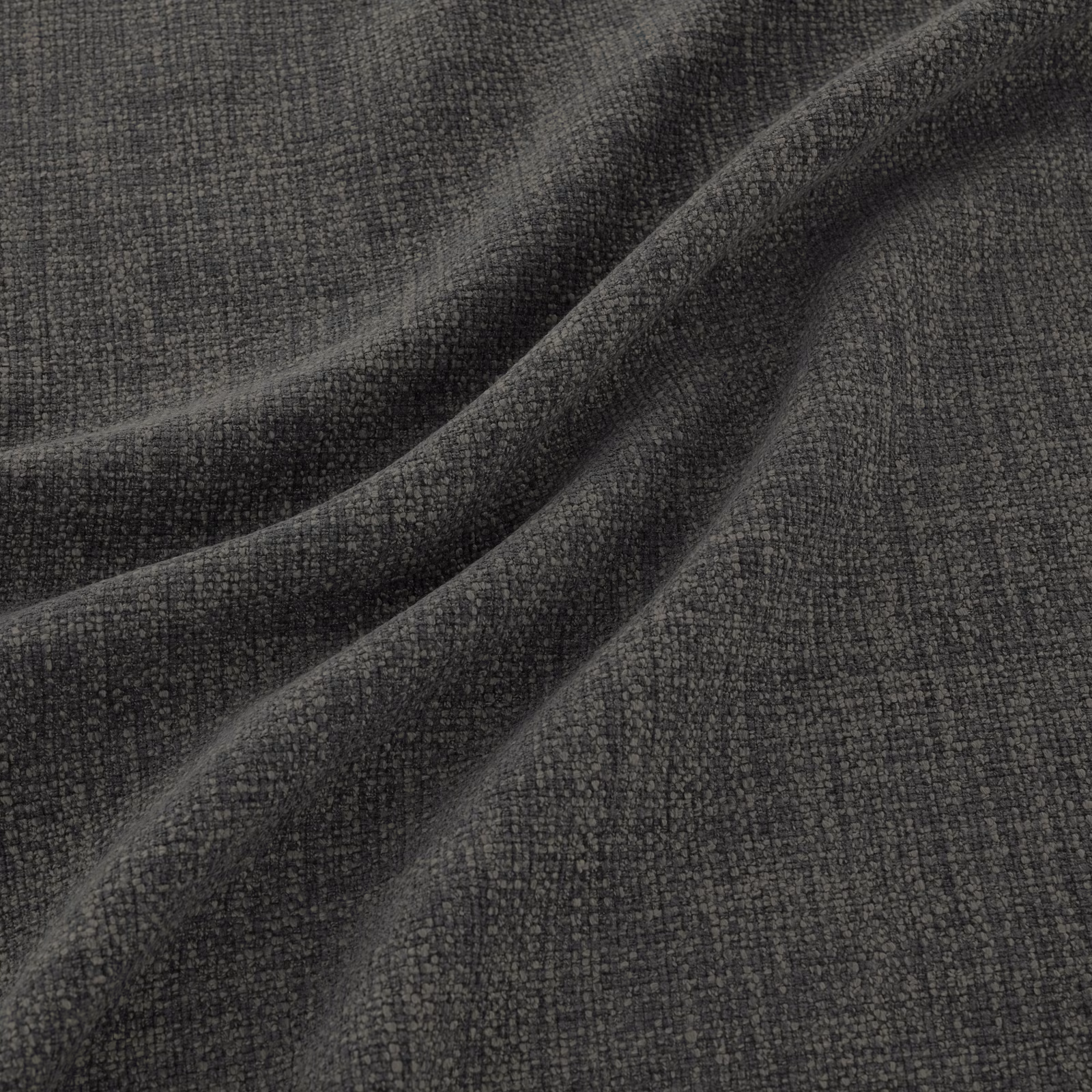 Close-up of charcoal-grey woven fabric with fine peppered texture and soft folds