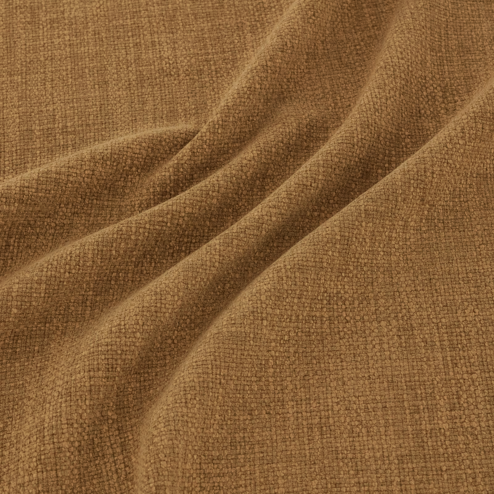 Warm nutmeg-brown woven fabric with fine tactile texture folded into soft drapes